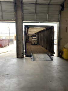 Maberry Trucking trailer at loading dock with forklift inside
