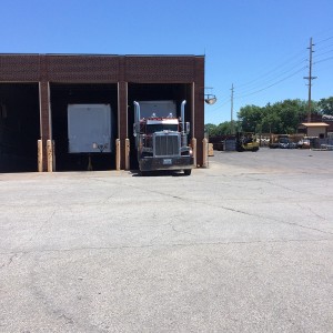 Truck pulled into loading dock building